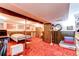 Open basement features a drop ceiling, bedroom area, and a carpeted floor at 10154 W Hawaii Pl, Lakewood, CO 80232
