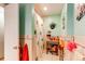 Playful bathroom featuring light turquoise walls, a sink, and a patterned shower curtain at 10154 W Hawaii Pl, Lakewood, CO 80232