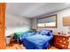 Bedroom with hardwood floors, two beds, and a dresser at 10154 W Hawaii Pl, Lakewood, CO 80232