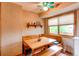 Charming breakfast nook featuring built-in bench seating, a wooden table, and natural light at 10154 W Hawaii Pl, Lakewood, CO 80232
