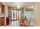 Cozy dining area featuring hardwood floors, modern chandelier, and natural lighting at 10154 W Hawaii Pl, Lakewood, CO 80232