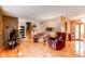 Bright living room with hardwood floors, comfortable seating, and easy access to dining area at 10154 W Hawaii Pl, Lakewood, CO 80232