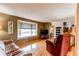 Spacious living room with hardwood floors, large window with bench seating, and comfortable furnishings at 10154 W Hawaii Pl, Lakewood, CO 80232