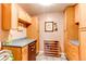 Butler's pantry features light wood cabinets and a wine rack at 10154 W Hawaii Pl, Lakewood, CO 80232