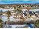 Aerial view of houses with snow on the ground at 671 Stafford Cir, Castle Rock, CO 80104