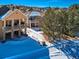 Aerial view of house and neighborhood in winter at 671 Stafford Cir, Castle Rock, CO 80104