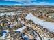 Wide aerial view of neighborhood in winter at 671 Stafford Cir, Castle Rock, CO 80104