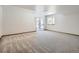 Spacious finished basement with sliding glass door access to backyard at 671 Stafford Cir, Castle Rock, CO 80104