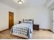 Cozy bedroom with wood floors and access to a balcony at 671 Stafford Cir, Castle Rock, CO 80104