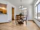 Bright dining room with hardwood floors and access to a deck at 671 Stafford Cir, Castle Rock, CO 80104