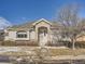 Nice Ranch style home with stone accents and a landscaped front yard at 671 Stafford Cir, Castle Rock, CO 80104