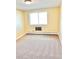 Spacious bedroom with neutral carpeting and large window at 9335 E Center Ave # 8B, Denver, CO 80247