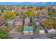 Aerial view of the property in a desirable residential neighborhood filled with trees at 2841 N Franklin St, Denver, CO 80205