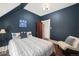 Navy bedroom showcases stylish decor, a comfortable bed, and a peaceful ambiance at 2841 N Franklin St, Denver, CO 80205