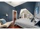 Navy bedroom with built-in shelving and a comfortable bed at 2841 N Franklin St, Denver, CO 80205