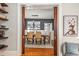 Elegant dining room with hardwood floors, vintage pendant lighting, and an open view of the adjacent living space at 2841 N Franklin St, Denver, CO 80205