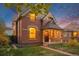 A lovely view of the home showcasing its architectural details and inviting front porch at 2841 N Franklin St, Denver, CO 80205