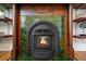 Close-up of a vintage fireplace with green tiles and decorative wood mantle, radiating warmth and charm at 2841 N Franklin St, Denver, CO 80205