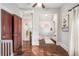 Hallway area with hardwood floors, natural light, and access to multiple rooms at 2841 N Franklin St, Denver, CO 80205