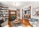 Cozy living room featuring a fireplace, built-in shelves, and an open view to the dining area at 2841 N Franklin St, Denver, CO 80205