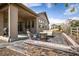 Backyard featuring an outdoor seating area with a stone fire pit and furniture during the day at 16392 Spanish Peak Way, Broomfield, CO 80023
