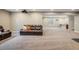 The finished basement includes carpet flooring, leather couches, and a wet bar at 16392 Spanish Peak Way, Broomfield, CO 80023