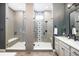 Contemporary bathroom with dual vanities, and glass-enclosed showers at 16392 Spanish Peak Way, Broomfield, CO 80023
