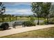 Seating area overlooking a community pond with stunning mountain views at 16392 Spanish Peak Way, Broomfield, CO 80023