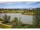 Picturesque lake view with walking paths in the welcoming community at 16392 Spanish Peak Way, Broomfield, CO 80023