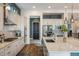 Contemporary kitchen with granite countertops, a center island, and a view of the backyard at 16392 Spanish Peak Way, Broomfield, CO 80023