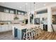 Well-appointed kitchen with a large center island, and modern appliances at 16392 Spanish Peak Way, Broomfield, CO 80023