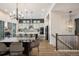 Gourmet kitchen featuring stainless steel appliances, large island, and elegant lighting fixtures at 16392 Spanish Peak Way, Broomfield, CO 80023