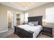This main bedroom has a tray ceiling with modern chandelier and includes a walk in closet at 16392 Spanish Peak Way, Broomfield, CO 80023