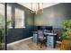 This home office includes two monitors, modern chair, and a large window providing plenty of natural light at 16392 Spanish Peak Way, Broomfield, CO 80023