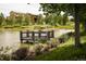 Scenic view of pond with community buildings in the background at 16392 Spanish Peak Way, Broomfield, CO 80023