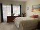 Cozy bedroom with a large window, traditional furniture, and soft natural light at 5455 S Dover S St # 102, Littleton, CO 80123