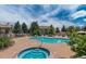 Relax in the sun at the community pool with a hot tub and lounge area at 5455 S Dover S St # 102, Littleton, CO 80123