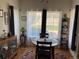 Bright dining area features a round table and a large window at 5455 S Dover S St # 102, Littleton, CO 80123