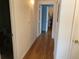 The hallway features hardwood floors and connects to various rooms in the home at 5455 S Dover S St # 102, Littleton, CO 80123