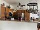 Charming kitchen featuring wooden cabinets, granite countertops, and stainless steel appliances at 5455 S Dover S St # 102, Littleton, CO 80123