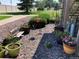 Lovely garden area featuring various potted plants and flowers amidst decorative stone at 5455 S Dover S St # 102, Littleton, CO 80123