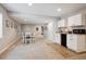 Finished basement featuring a small dining area, kitchenette, and comfortable carpeted flooring at 1488 Baguette Dr, Castle Rock, CO 80108