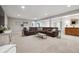 Finished basement featuring comfortable seating and a contemporary interior design at 1488 Baguette Dr, Castle Rock, CO 80108