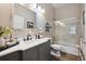Charming bathroom has a glass enclosed shower, with a gray vanity, wood look floors, and modern mirror at 1488 Baguette Dr, Castle Rock, CO 80108