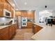This spacious kitchen is equipped with stainless steel appliances and ample wood cabinets at 1488 Baguette Dr, Castle Rock, CO 80108
