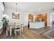 Bright eat-in kitchen features a dining table and island with stainless steel appliances, and wood cabinets at 1488 Baguette Dr, Castle Rock, CO 80108