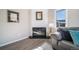 Modern corner fireplace with white brick surround in living room at 25 Irene Ct, Broomfield, CO 80020