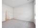 This bedroom offers neutral walls, soft carpeting and a door into the hallway at 485 Interlocken Blvd # 102, Broomfield, CO 80021