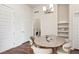 Cozy dining area featuring a modern chandelier, and a convenient laundry area at 485 Interlocken Blvd # 102, Broomfield, CO 80021
