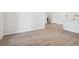 Picture of empty room with light colored walls and wood floors at 485 Interlocken Blvd # 102, Broomfield, CO 80021